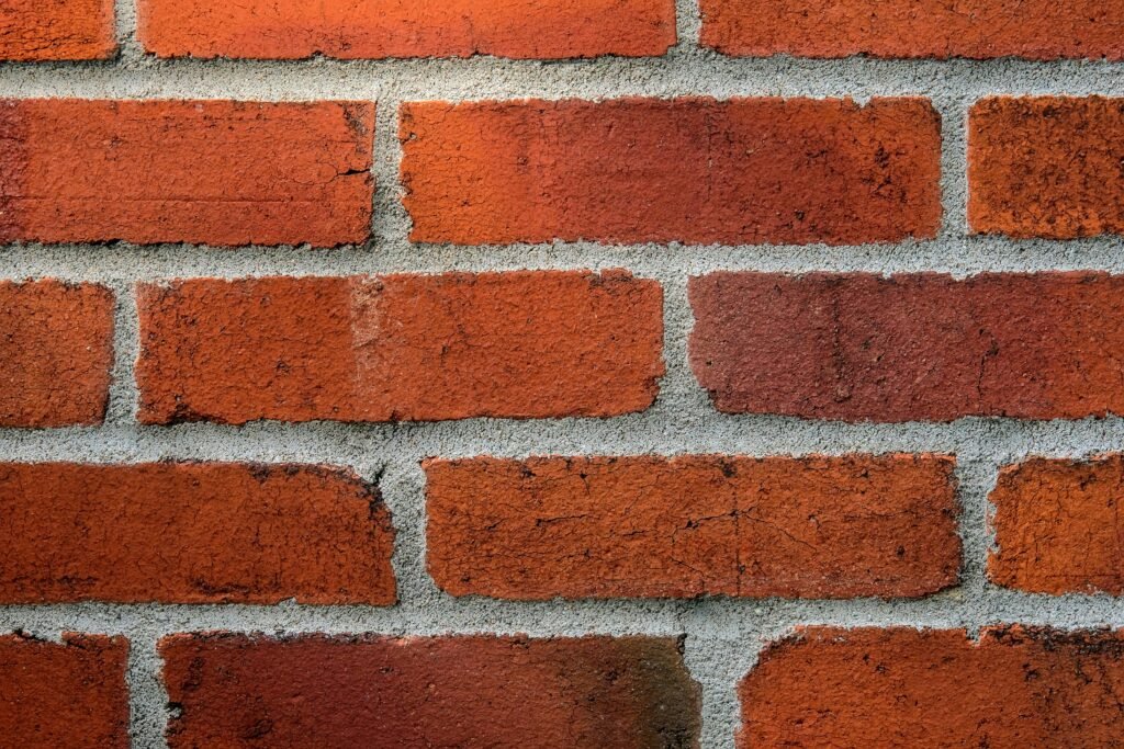 pexels photo 14706626 14706626 Detailed close-up of a red brick wall showing texture and mortar lines.