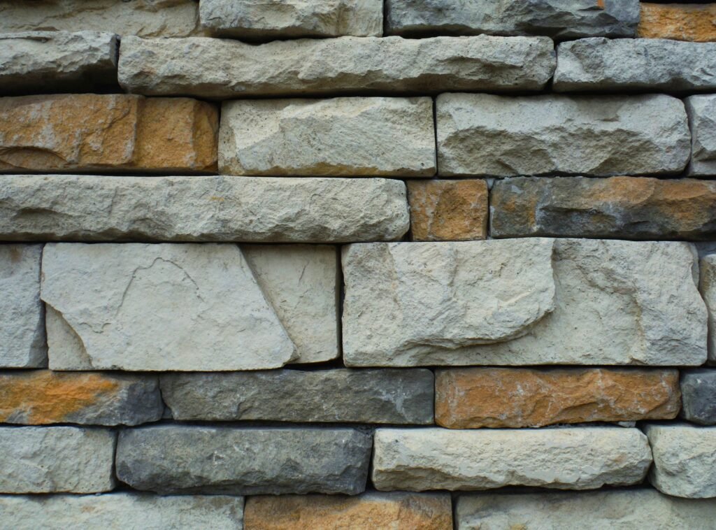 pexels photo 194096 194096 Close-up of a textured stone wall with a variety of natural colors.